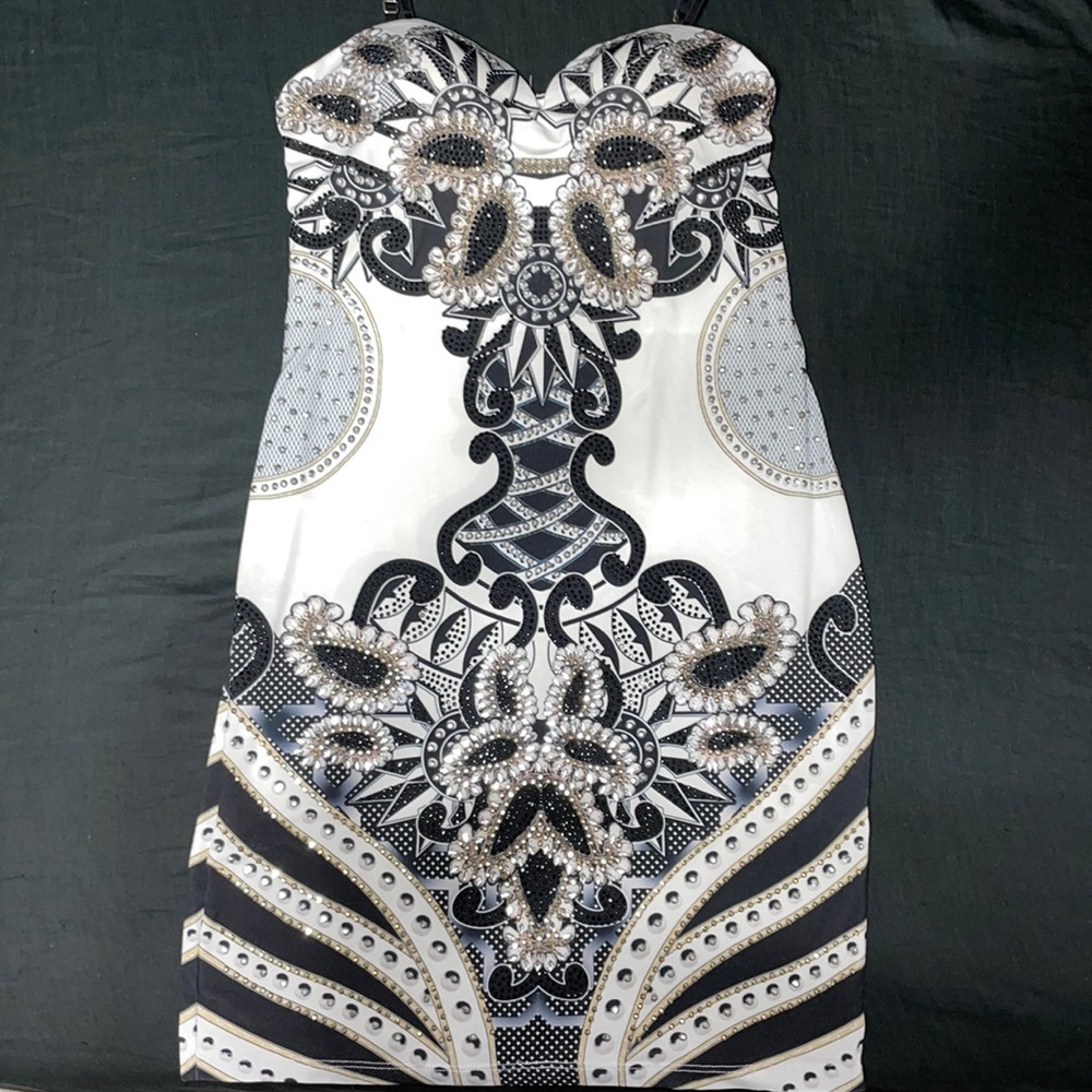 Gorgeous skin, tight dress with bling